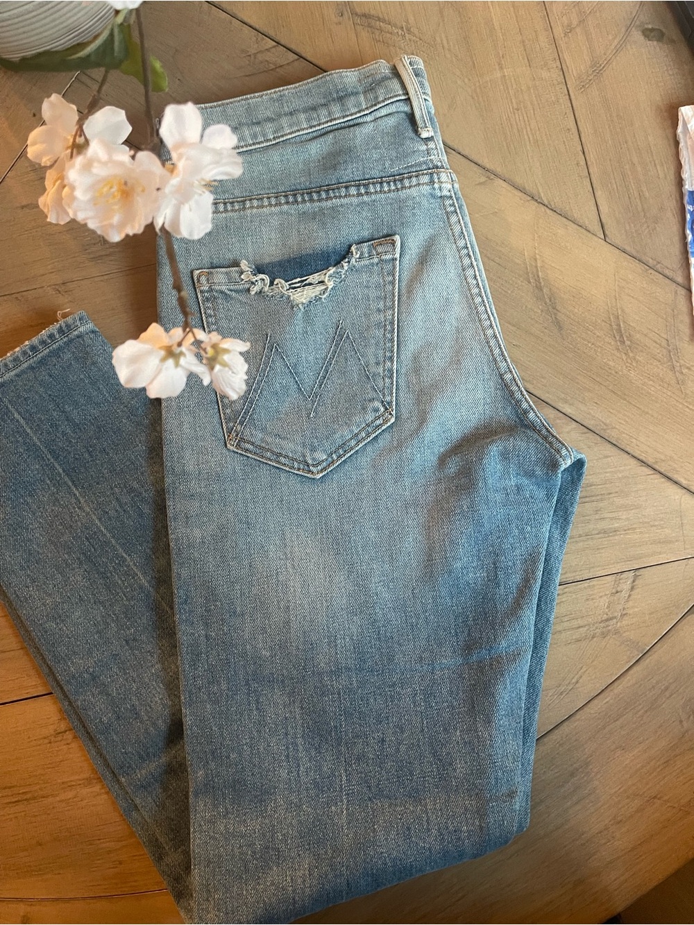 MOTHER High-Rise Light Blue Denim Jeans with Distressed Back Pocket